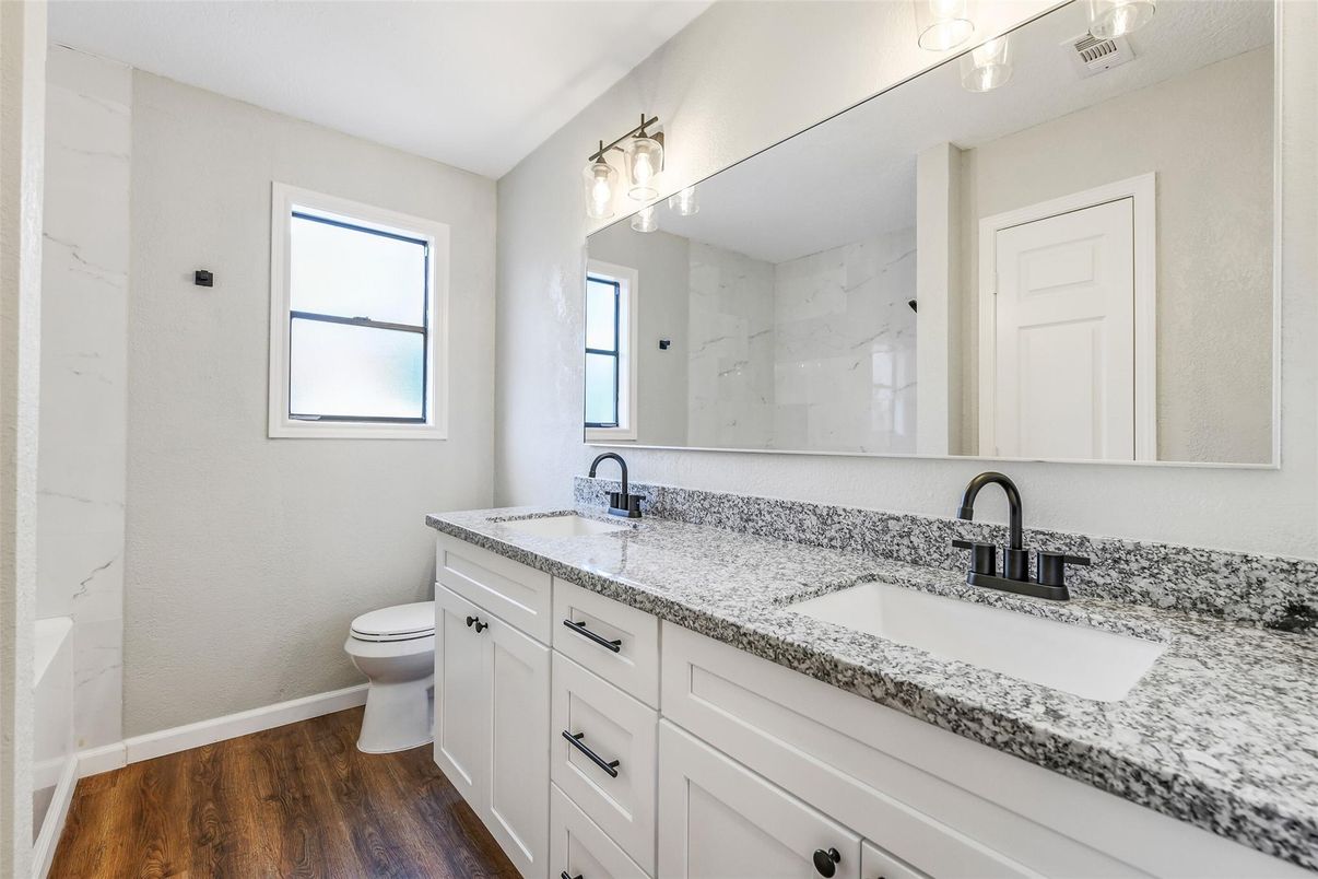 Bathroom, Dual Sink Vanities, Interior, Marble Walls, Wood Texture Flooring