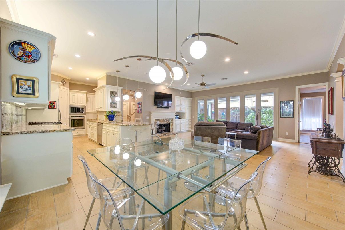 Dining room, Fireplace, Interior, Kitchen, Living room, Pendant Lights, Recessed Lighting, Stainless Steel Appliances, Wood Texture Flooring