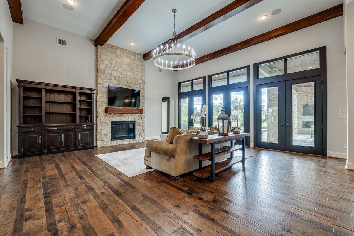 Chandelier, Fireplace, Home Office, Interior, Living room, Recessed Lighting, Stone Walls, Wooden Beams, Wood Texture Flooring