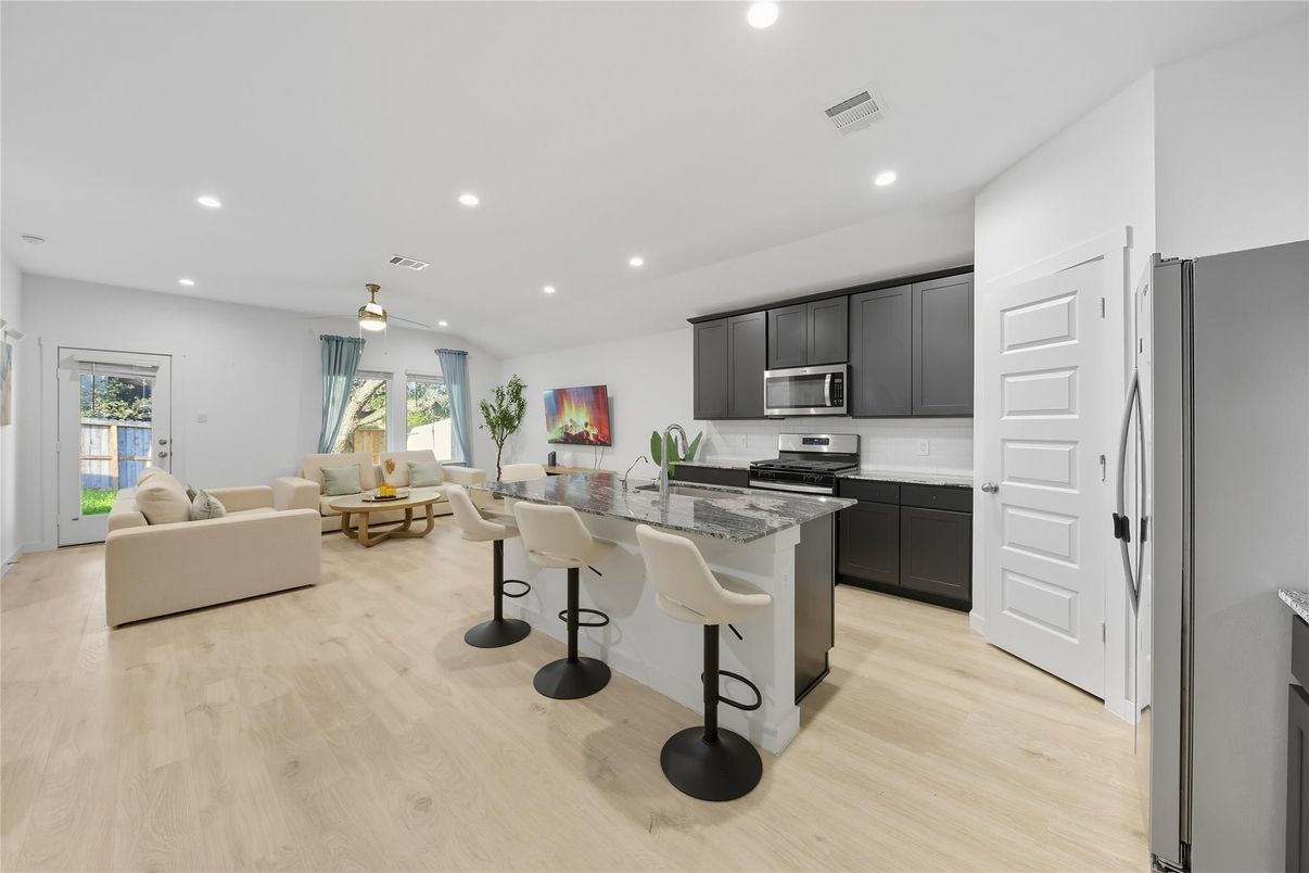Dining room, Interior, Kitchen, Living room, Recessed Lighting, Stainless Steel Appliances, Wood Texture Flooring