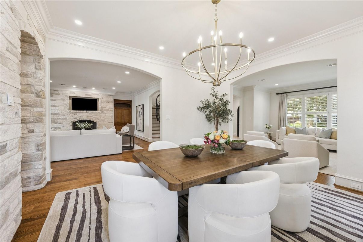 Chandelier, Dining room, Fireplace, Interior, Living room, Pendant Lights, Recessed Lighting, Stone Walls, Wood Texture Flooring
