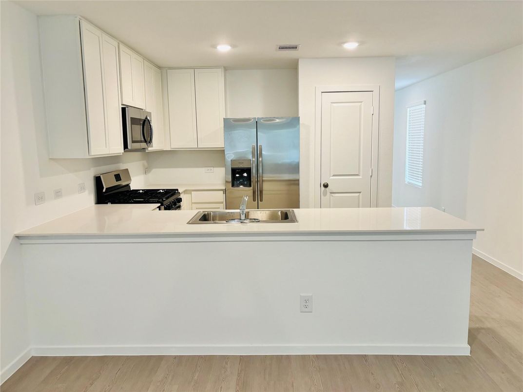 Interior, Kitchen, Recessed Lighting, Stainless Steel Appliances, Wood Texture Flooring