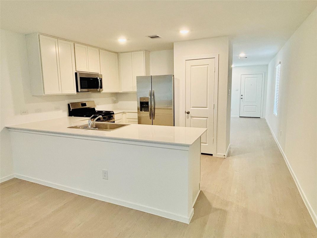 Interior, Kitchen, Recessed Lighting, Stainless Steel Appliances, Wood Texture Flooring