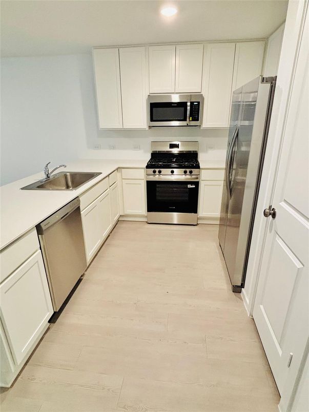 Interior, Kitchen, Recessed Lighting, Stainless Steel Appliances, Wood Texture Flooring