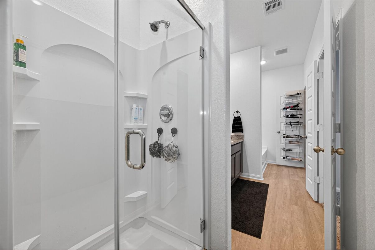 Bathroom, Glass Shower, Interior, Recessed Lighting, Walk-in Closets, Wood Texture Flooring