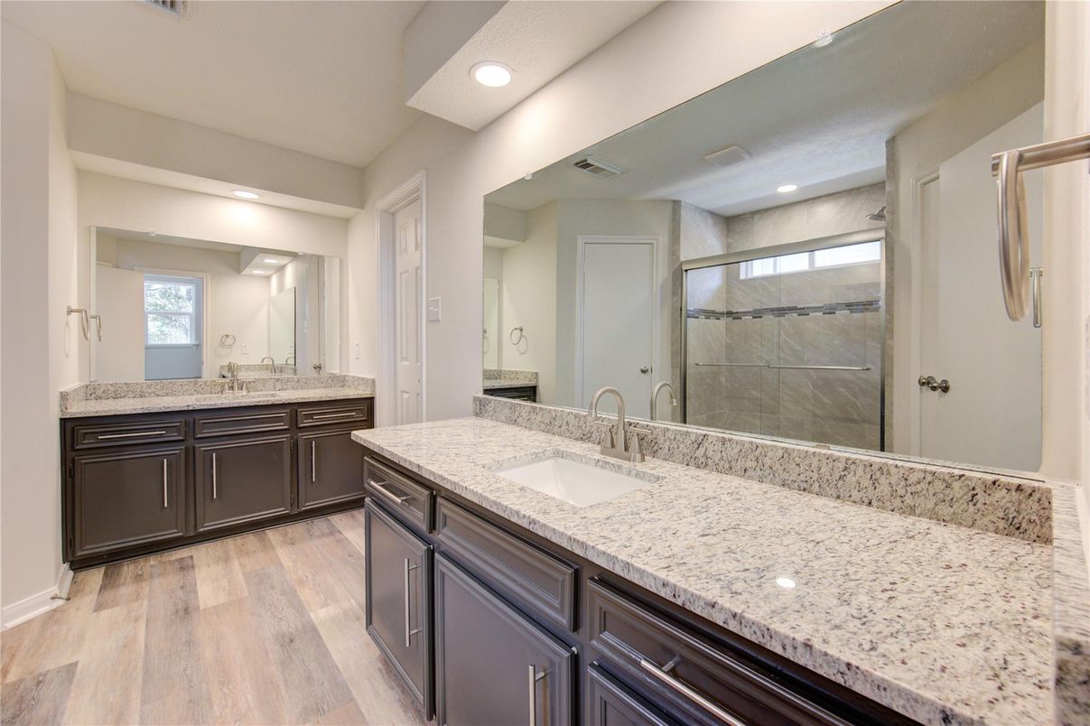 Bathroom, Dual Sink Vanities, Glass Shower, Interior, Recessed Lighting, Wood Texture Flooring