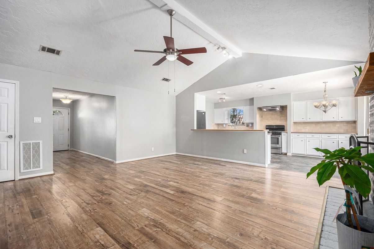 Chandelier, Empty room, Interior, Kitchen, Recessed Lighting, Stainless Steel Appliances, Wood Texture Flooring