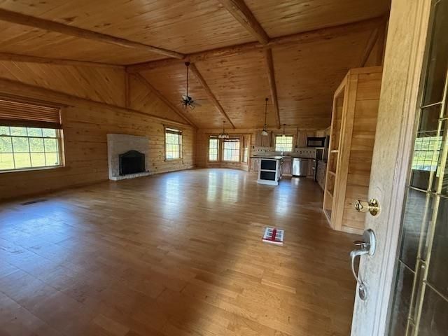 Empty room, Fireplace, Interior, Kitchen, Stainless Steel Appliances, Stone Walls, Wooden Beams, Wooden Ceilings, Wood Texture Flooring, Wooden Walls