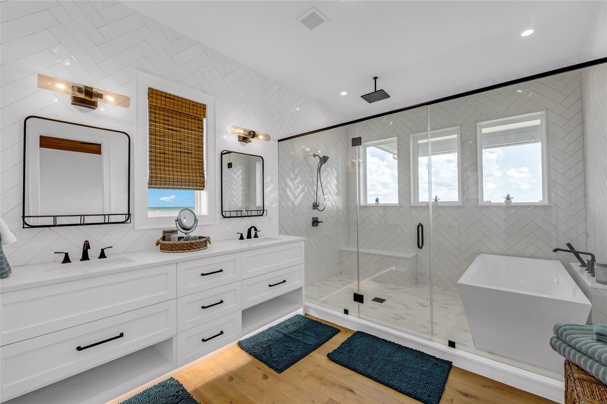 Bathroom, Dual Sink Vanities, Free Standing Baths, Glass Shower, Interior, Recessed Lighting, Wood Texture Flooring
