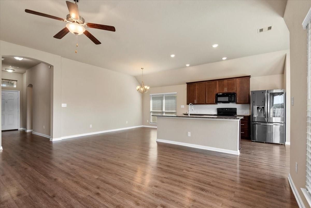 Chandelier, Empty room, Interior, Kitchen, Recessed Lighting, Stainless Steel Appliances, Wood Texture Flooring