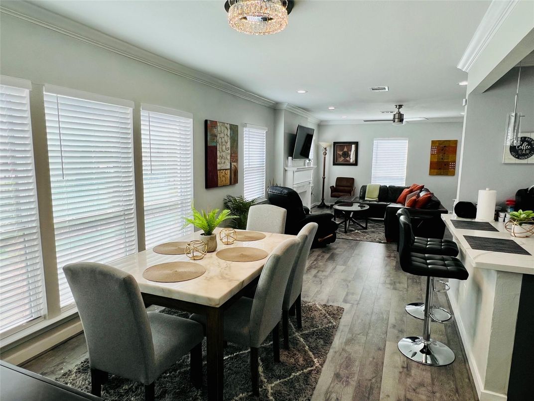 Dining room, Fireplace, Interior, Living room, Recessed Lighting, Wood Texture Flooring