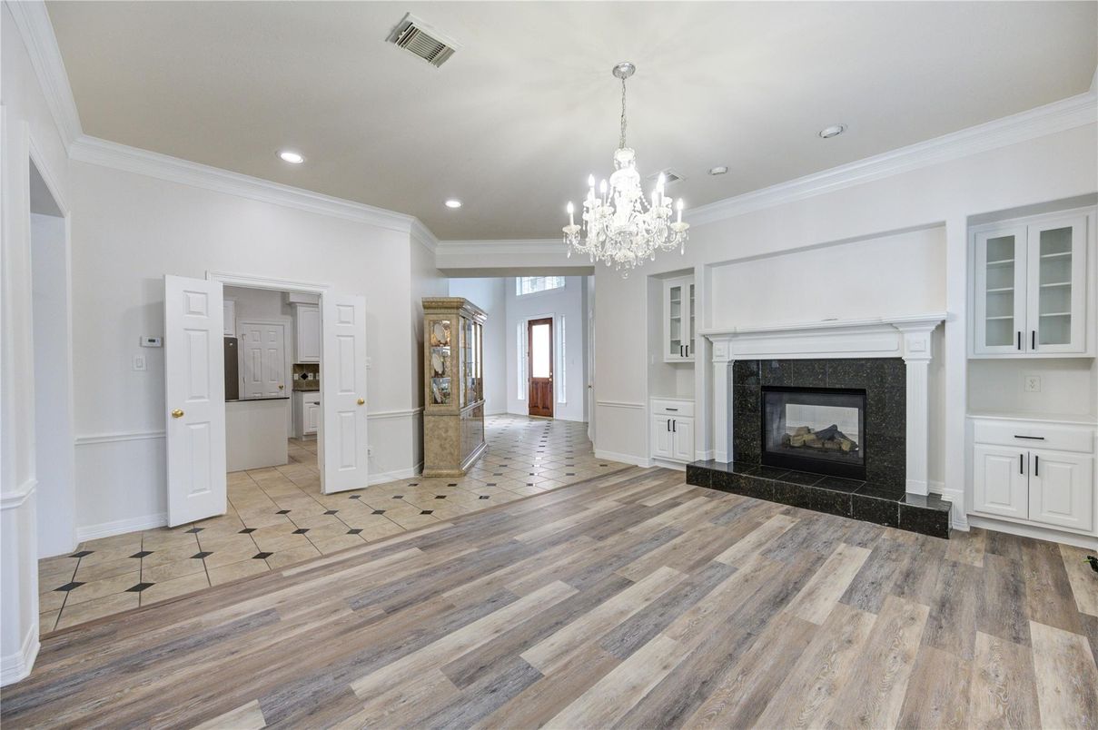 Chandelier, Empty room, Fireplace, Interior, Recessed Lighting, Wood Texture Flooring