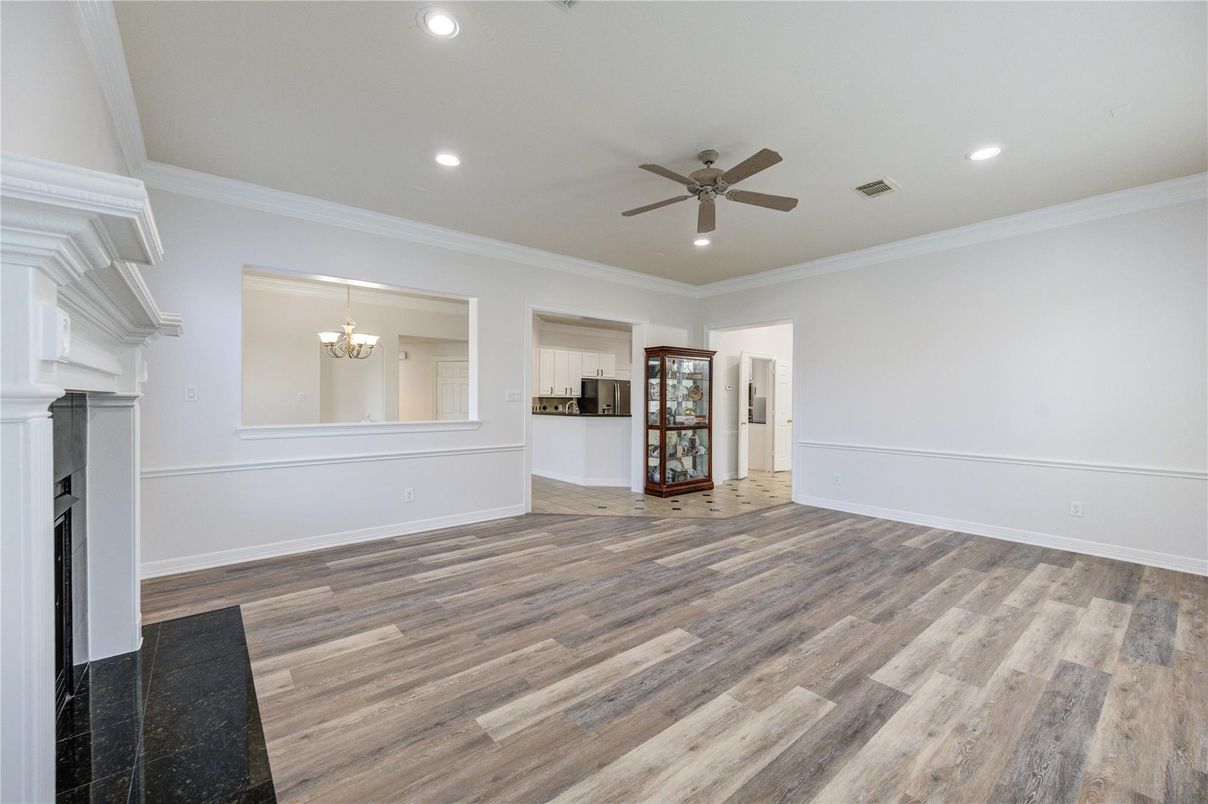 Chandelier, Empty room, Fireplace, Interior, Recessed Lighting, Wood Texture Flooring