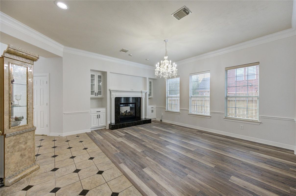 Chandelier, Empty room, Fireplace, Interior, Recessed Lighting, Wood Texture Flooring