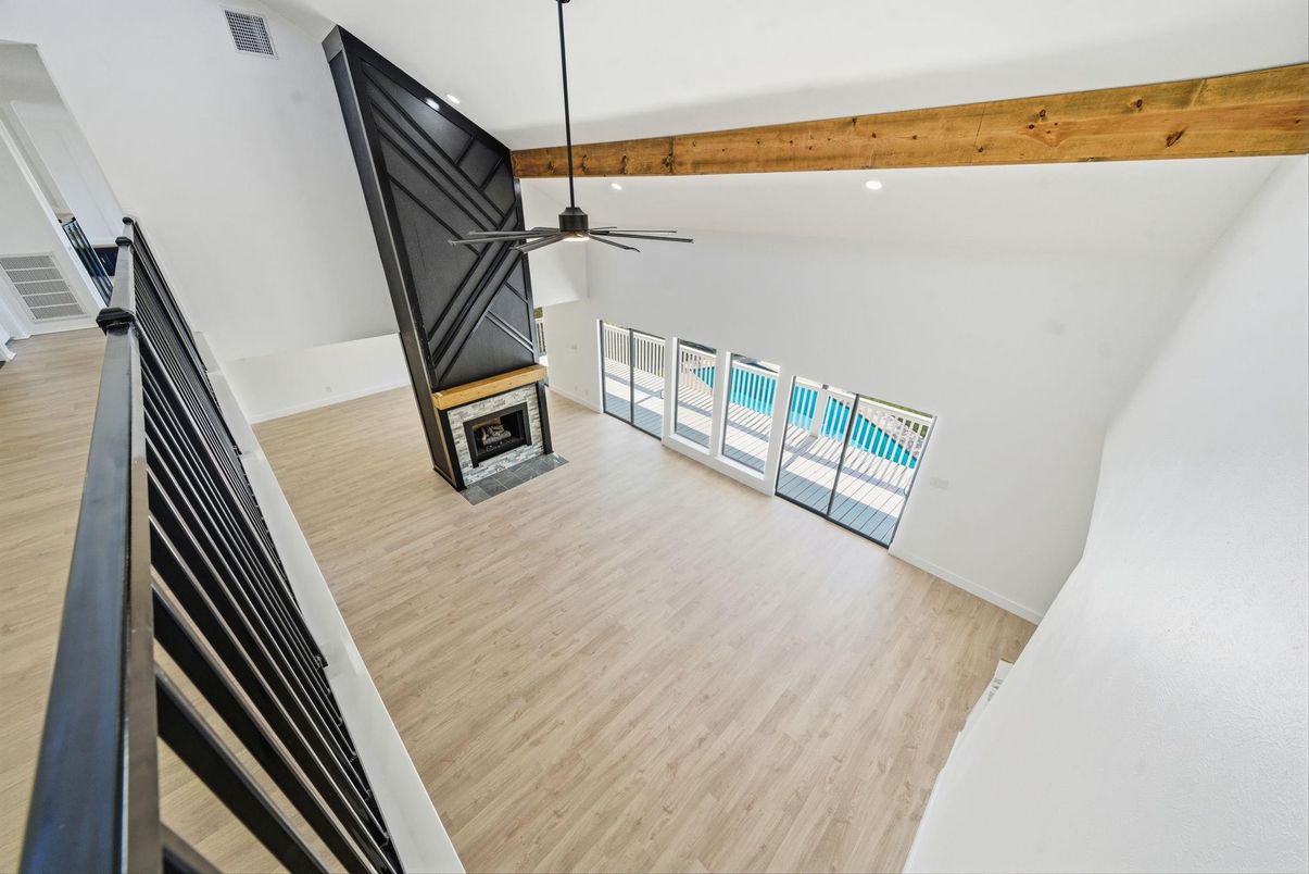 Empty room, Fireplace, Interior, Pendant Lights, Recessed Lighting, Wooden Beams, Wood Texture Flooring
