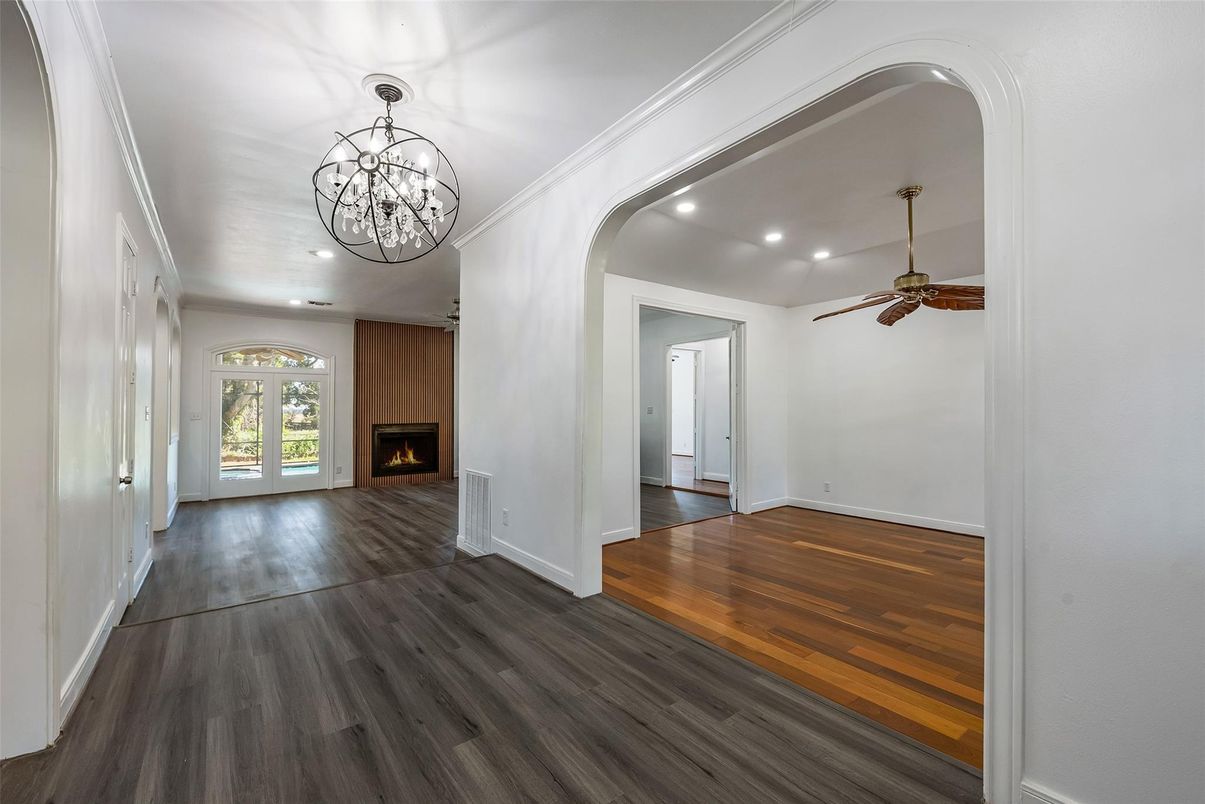Chandelier, Empty room, Fireplace, Interior, Recessed Lighting, Wood Texture Flooring