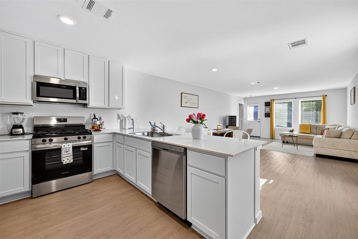 Dining room, Interior, Kitchen, Living room, Recessed Lighting, Stainless Steel Appliances, Wood Texture Flooring
