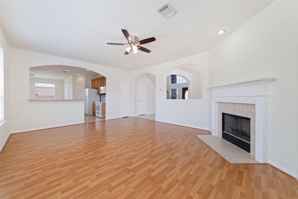 Empty room, Fireplace, Interior, Kitchen, Recessed Lighting, Wood Texture Flooring