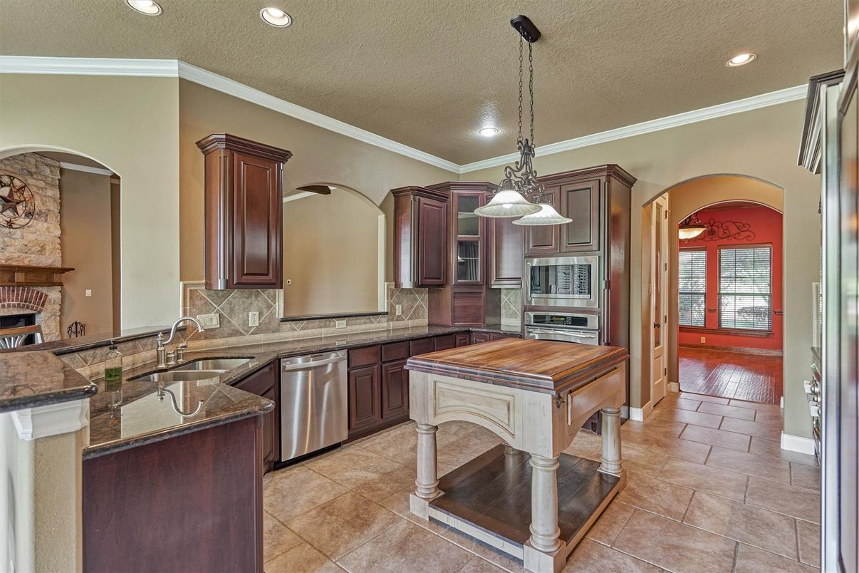 Fireplace, Interior, Kitchen, Pendant Lights, Recessed Lighting, Stainless Steel Appliances