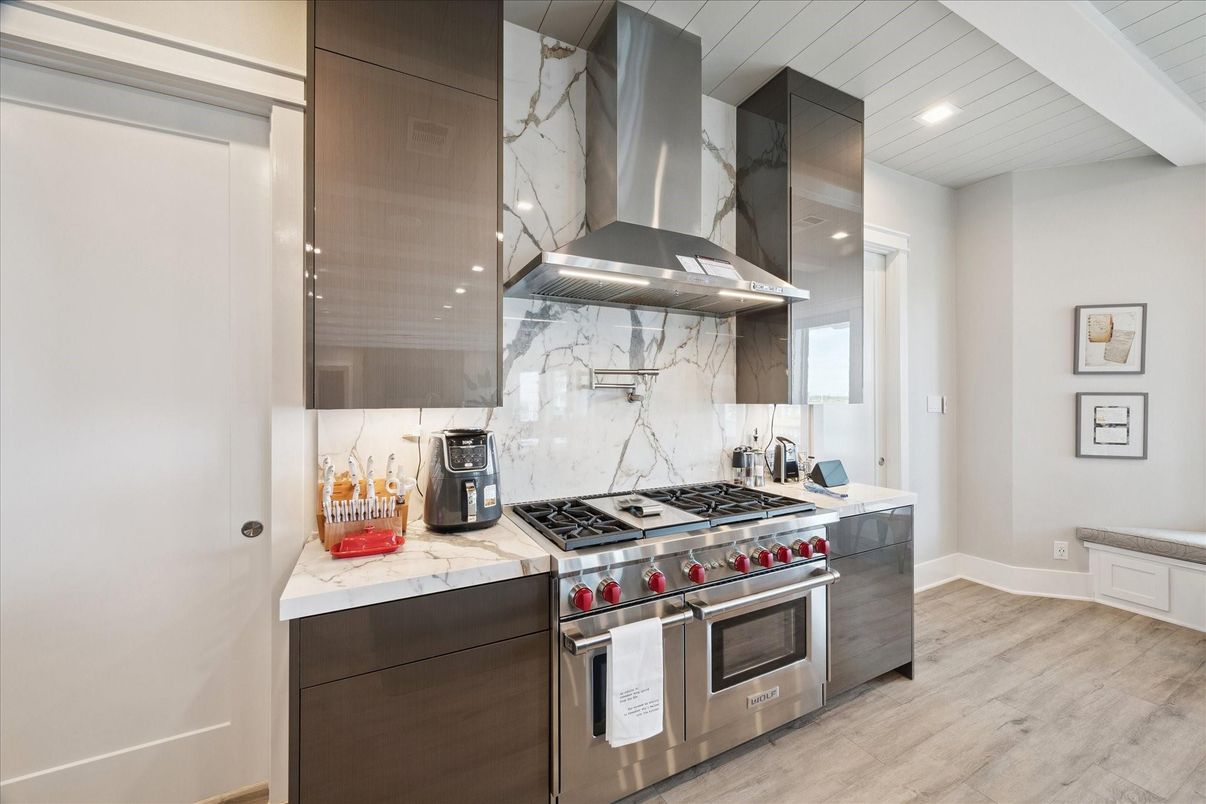 Interior, Kitchen, Marble Walls, Recessed Lighting, Stainless Steel Appliances, Wood Texture Flooring