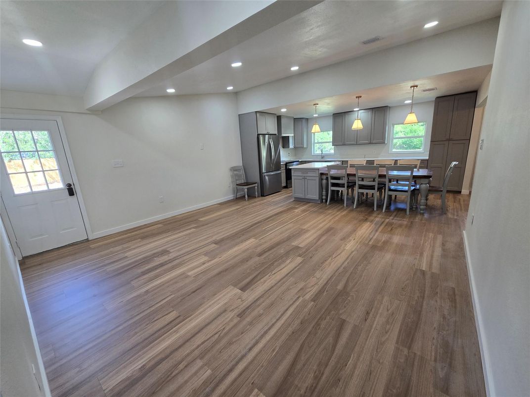 Dining room, Interior, Kitchen, Pendant Lights, Recessed Lighting, Stainless Steel Appliances, Wood Texture Flooring