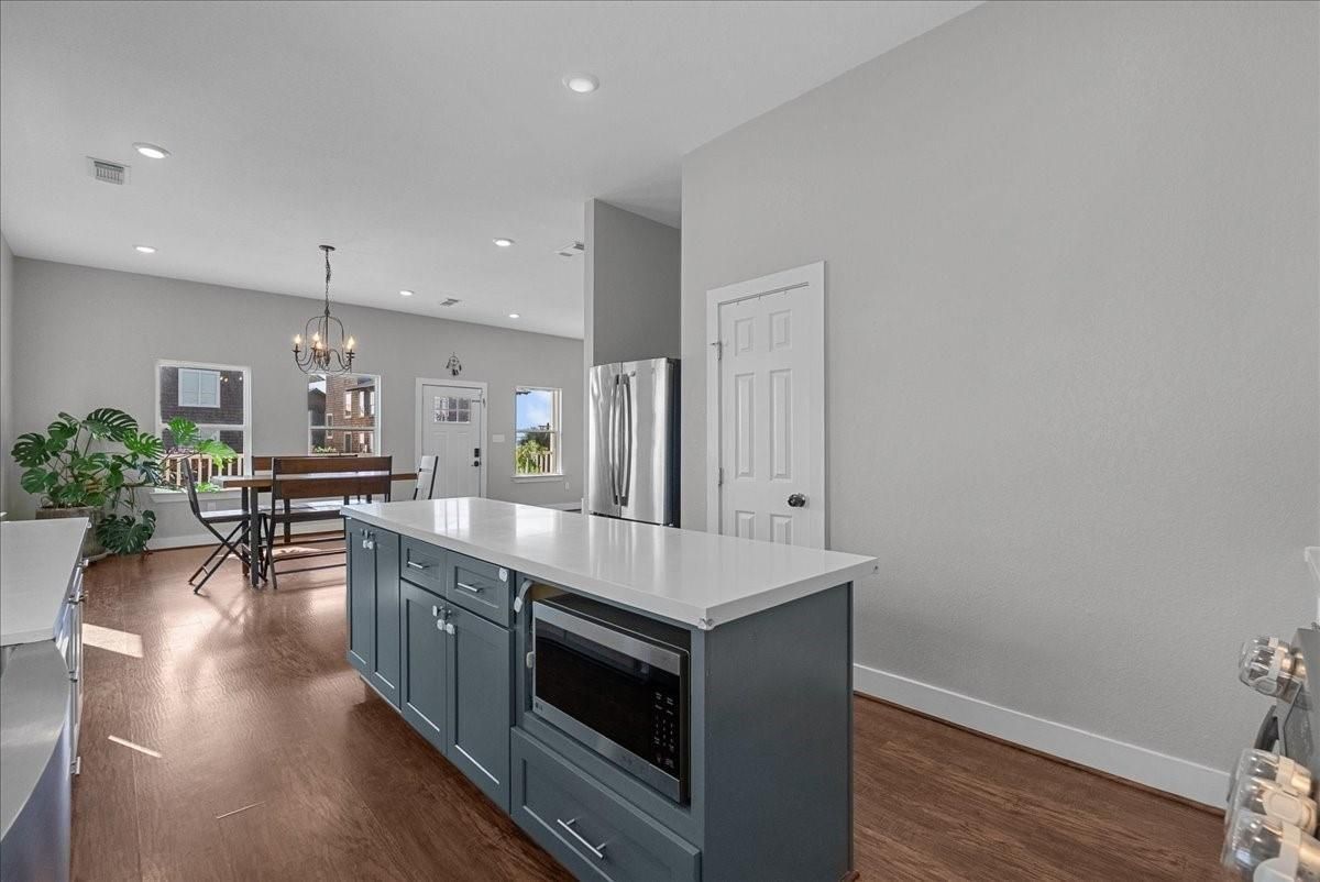 Chandelier, Dining room, Interior, Kitchen, Recessed Lighting, Stainless Steel Appliances, Wood Texture Flooring