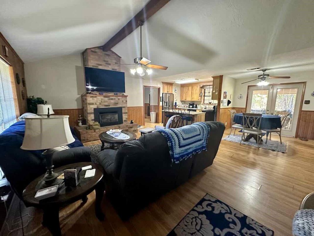 Dining room, Fireplace, Interior, Kitchen, Living room, Stone Walls, Wood Texture Flooring