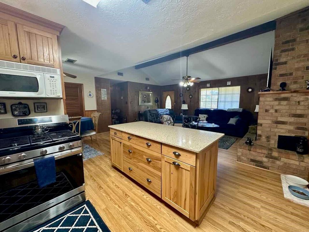 Dining room, Interior, Kitchen, Living room, Stainless Steel Appliances, Stone Walls, Wood Texture Flooring