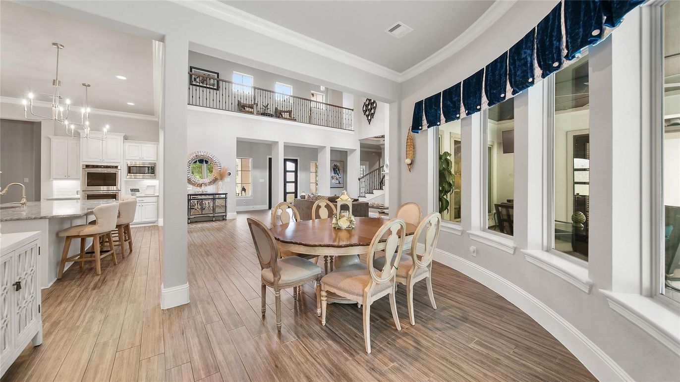 Dining room, Interior, Kitchen, Pendant Lights, Recessed Lighting, Stainless Steel Appliances, Wood Texture Flooring