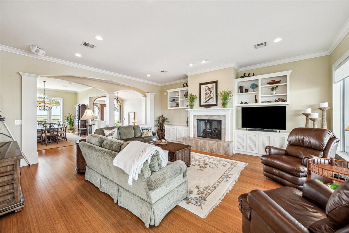 Dining room, Fireplace, Interior, Living room, Pendant Lights, Recessed Lighting, Wood Texture Flooring