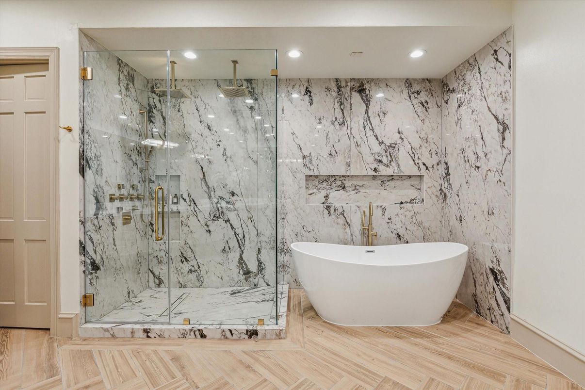 Bathroom, Free Standing Baths, Glass Shower, Interior, Marble Walls, Recessed Lighting, Wood Texture Flooring