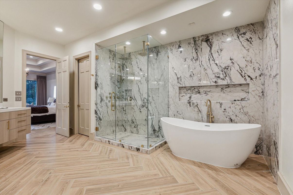 Bathroom, Free Standing Baths, Glass Shower, Interior, Marble Walls, Recessed Lighting, Wood Texture Flooring