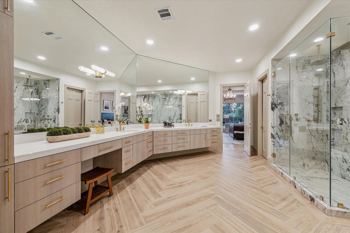 Bathroom, Dual Sink Vanities, Glass Shower, Interior, Marble Walls, Recessed Lighting, Wood Texture Flooring