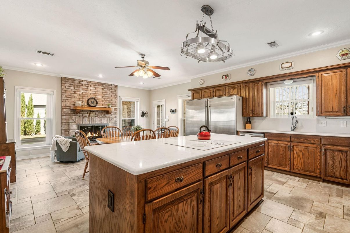 Fireplace, Interior, Kitchen, Living room, Recessed Lighting, Stainless Steel Appliances, Stone Walls