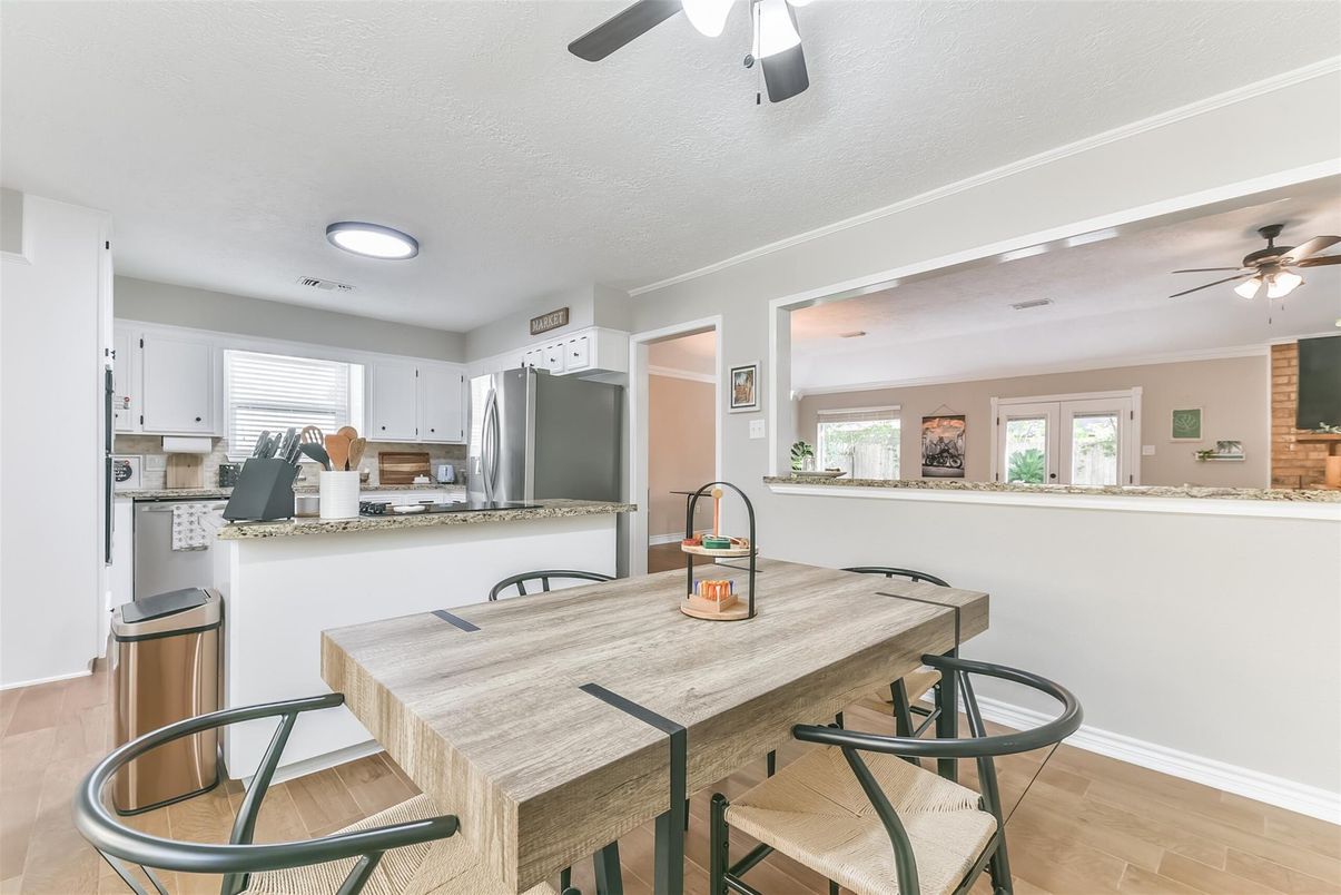 Dining room, Interior, Kitchen, Recessed Lighting, Stainless Steel Appliances, Wood Texture Flooring
