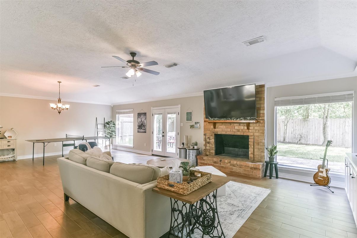 Chandelier, Dining room, Fireplace, Interior, Living room, Stone Walls, Wood Texture Flooring