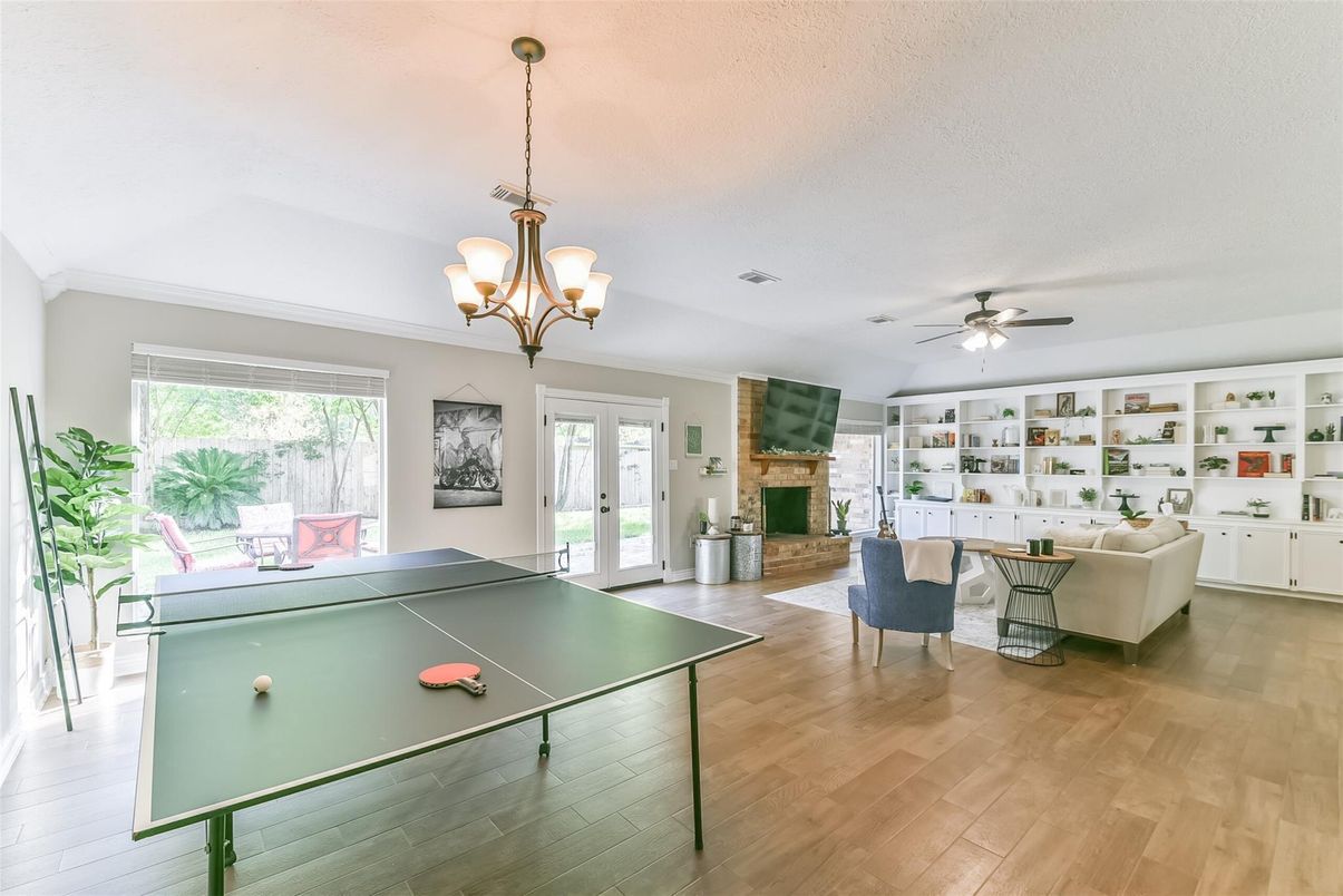 Chandelier, Fireplace, Game Room, Interior, Living room, Wood Texture Flooring