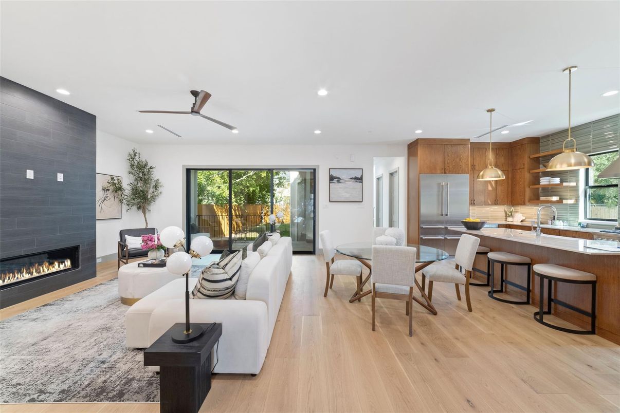 Dining room, Fireplace, Interior, Kitchen, Living room, Pendant Lights, Recessed Lighting, Stainless Steel Appliances, Wood Texture Flooring