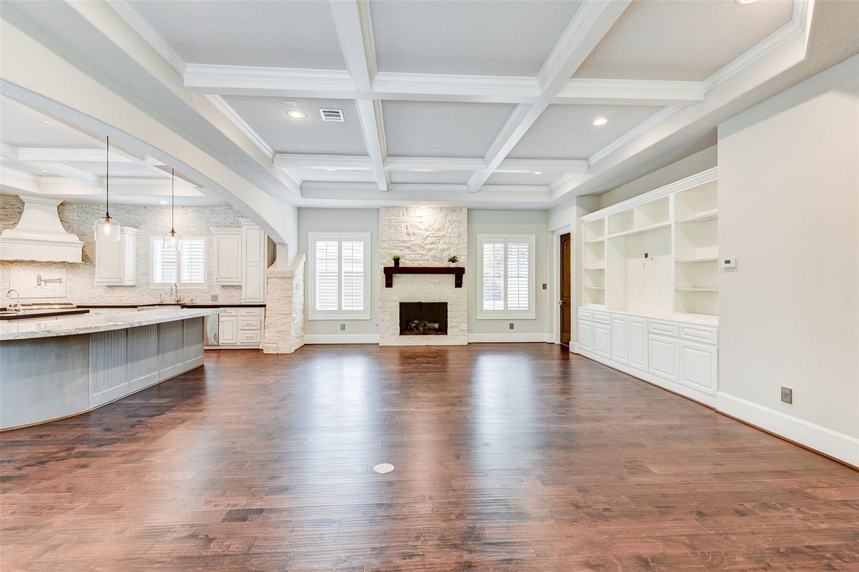 Empty room, Fireplace, Interior, Kitchen, Pendant Lights, Recessed Lighting, Wood Texture Flooring