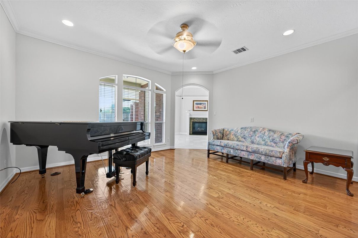 Fireplace, Interior, Piano, Recessed Lighting, Wood Texture Flooring