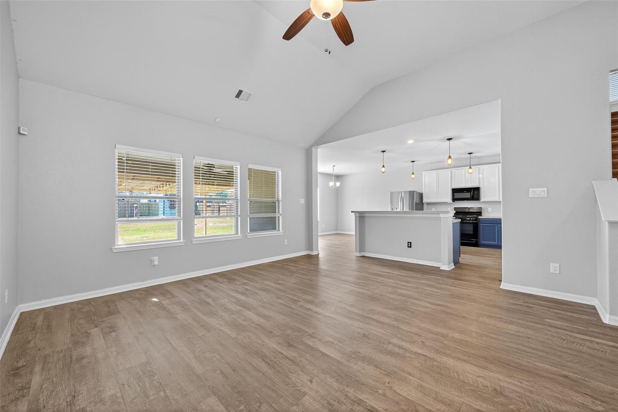 Empty room, Interior, Kitchen, Pendant Lights, Stainless Steel Appliances, Wood Texture Flooring
