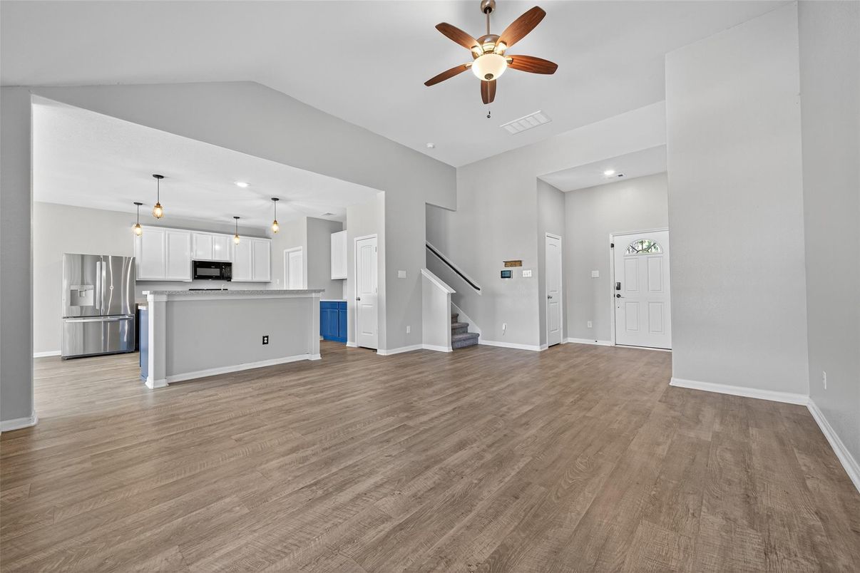 Empty room, Interior, Kitchen, Pendant Lights, Stainless Steel Appliances, Wood Texture Flooring