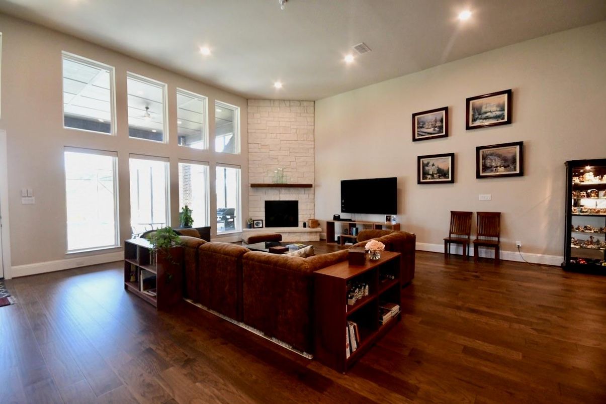 Fireplace, Interior, Living room, Recessed Lighting, Stone Walls, Wood Texture Flooring