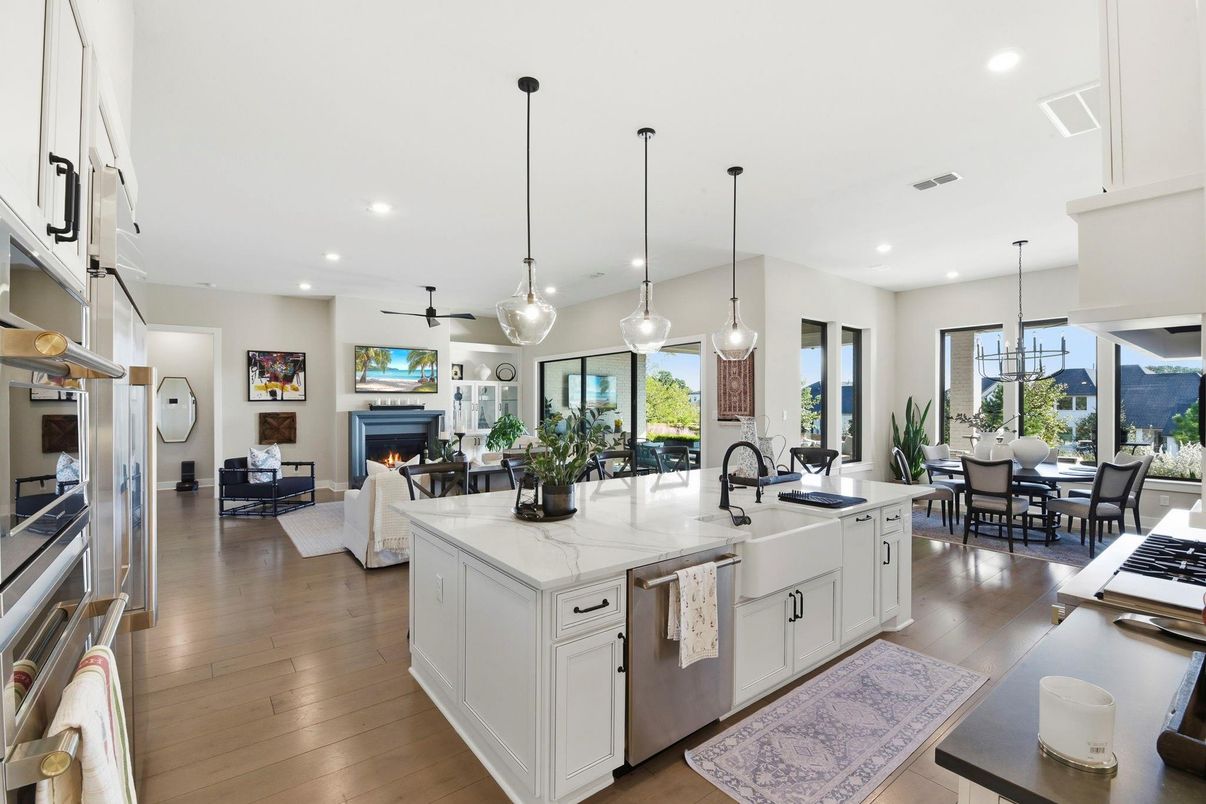 Dining room, Fireplace, Interior, Kitchen, Living room, Pendant Lights, Recessed Lighting, Stainless Steel Appliances, Wood Texture Flooring