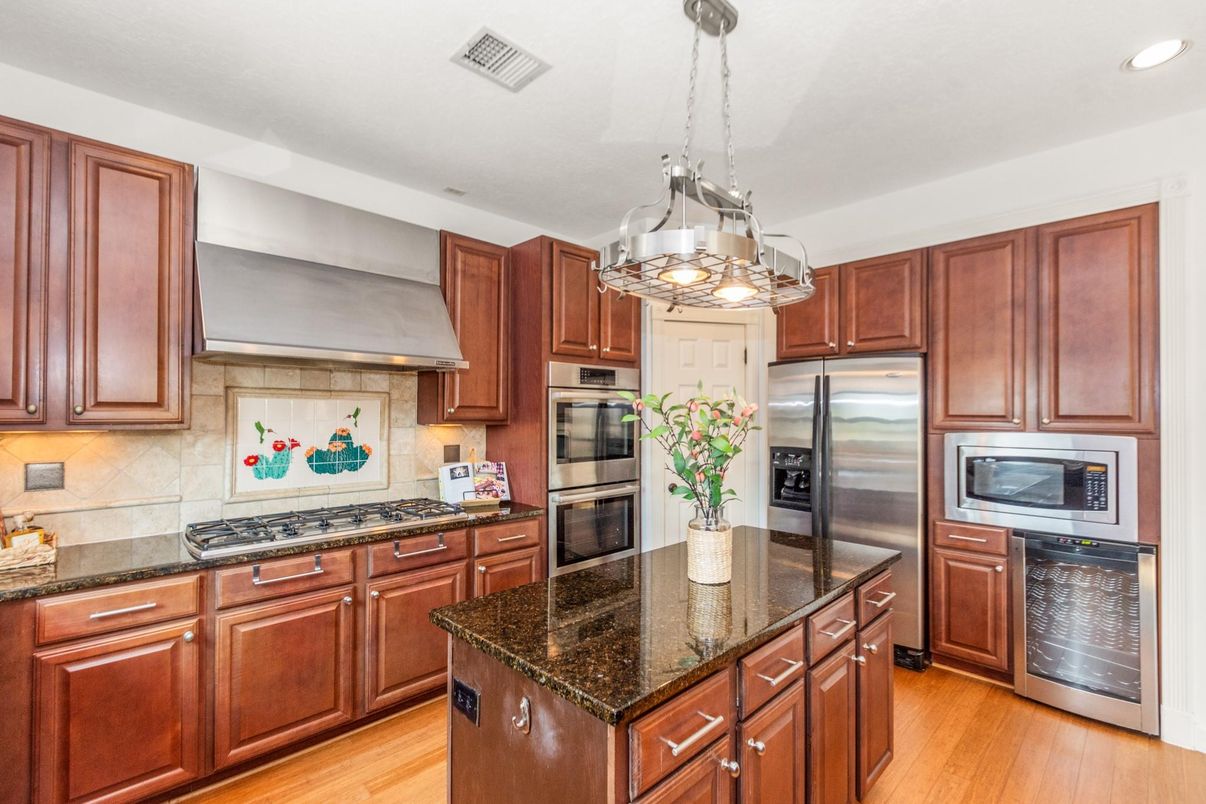 Chandelier, Interior, Kitchen, Pendant Lights, Recessed Lighting, Stainless Steel Appliances, Wood Texture Flooring