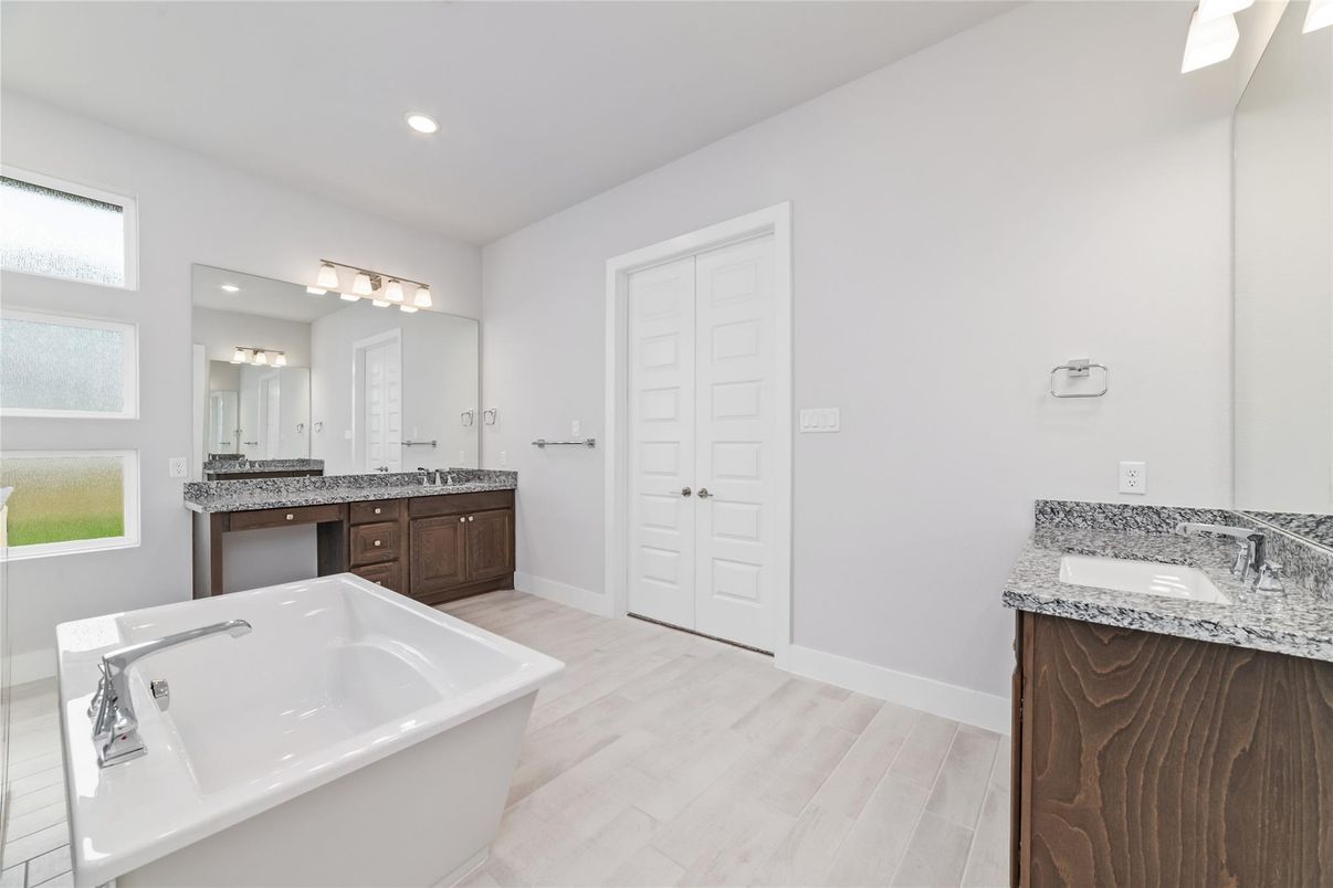 Bathroom, Dual Sink Vanities, Free Standing Baths, Interior, Recessed Lighting, Wood Texture Flooring