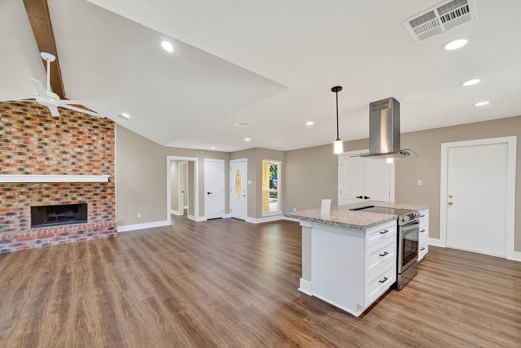 Fireplace, Interior, Kitchen, Pendant Lights, Recessed Lighting, Stone Walls, Wood Texture Flooring