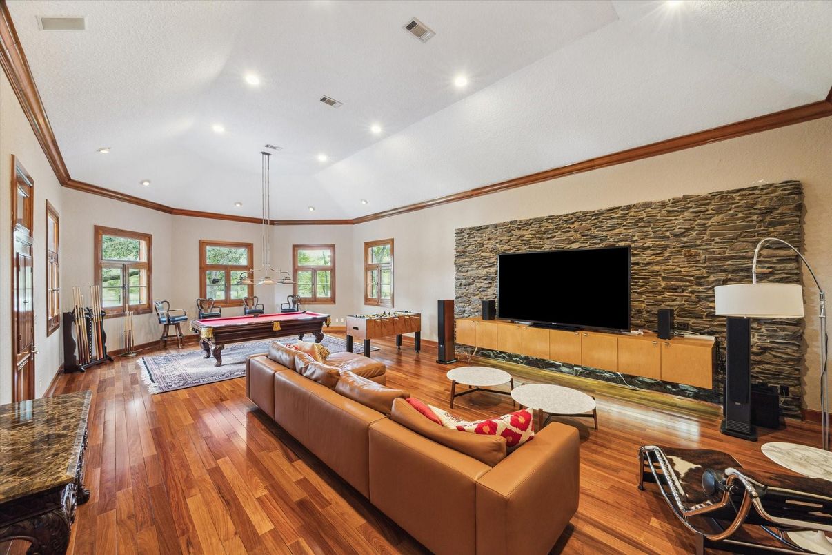 Billiard Table, Fireplace, Game Room, Interior, Living room, Pendant Lights, Recessed Lighting, Wood Texture Flooring