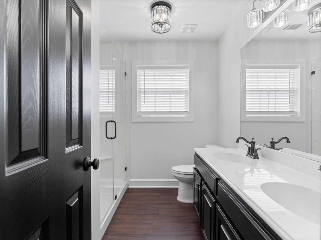 Bathroom, Dual Sink Vanities, Glass Shower, Interior, Tile Countertops, Wood Texture Flooring