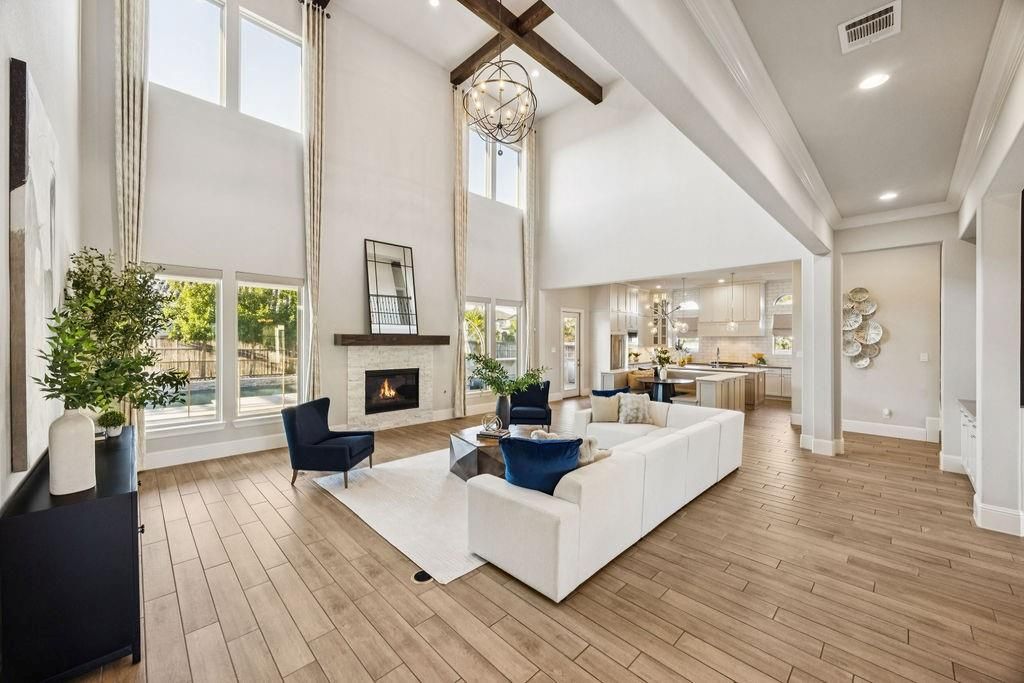 Chandelier, Fireplace, Interior, Living room, Pendant Lights, Recessed Lighting, Wooden Beams, Wood Texture Flooring